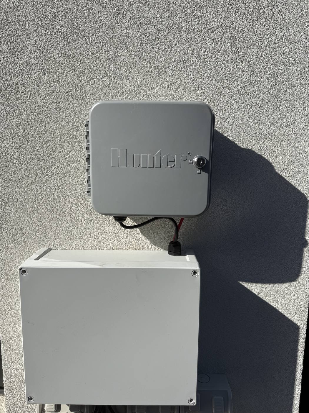 A clean Hunter controller install on a rendered wall